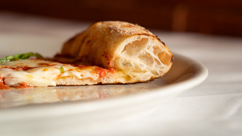 Classic dion's cheese pizza with golden crust